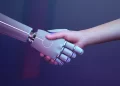 human and robot shaking hand